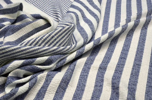 istock Jacquard with lurex in blue and white stripes 1034750644
