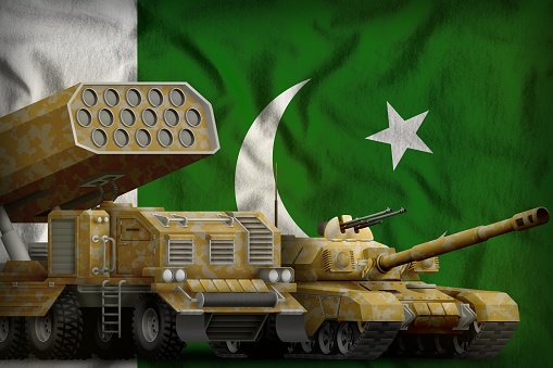 tank and rocket launcher with yellow camouflage on the Pakistan flag background. Pakistan heavy military armored vehicles concept. 3d Illustration