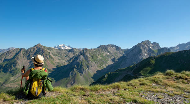 istock hiker woman resting a moment and looking a mountains 1034753226