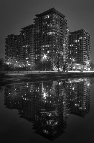 istock Black and white night shot with modern buildings 1034753952