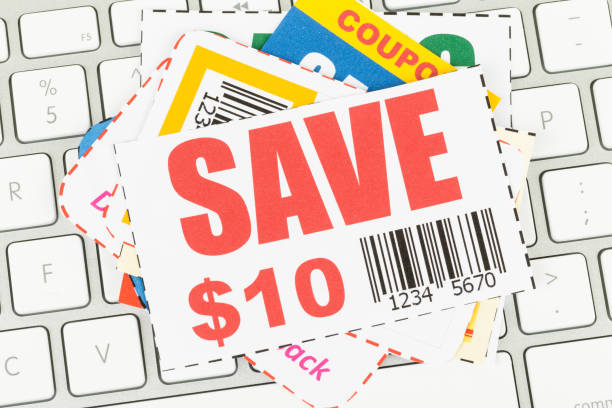 istock Saving discount coupon voucher on keyboard, coupons are mock-up 1034754196