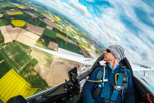 View from a glider in flight over yellow rapeseed fields