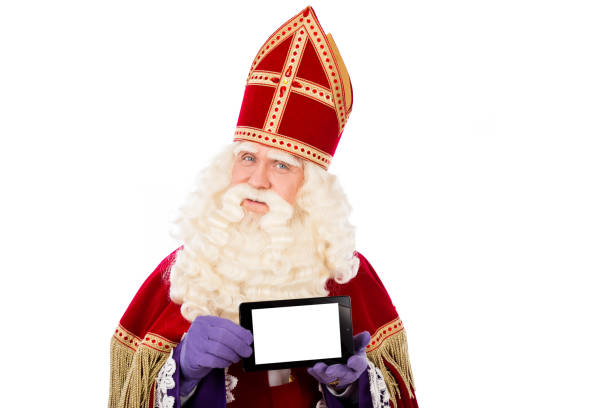 saint nicholas with smart phone or tablet.dutch sinterklaas - piet imagens e fotografias de stock