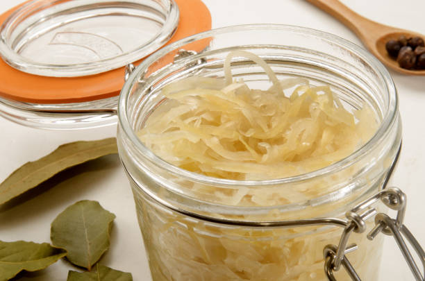 istock sauerkraut in a glass jar with bayleaf 1034761120