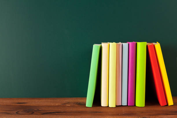 istock Books on Desk, Chalkboard Background 1034764670