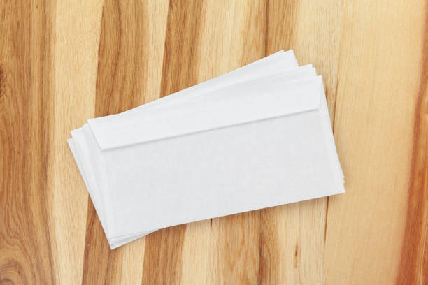 istock Blank white envelope on wooden background 1034768118