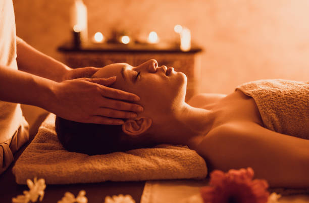 istock Relaxed black woman having head massage at the spa. 1034779200