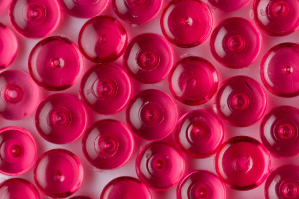 istock Red acrylic beads on a white background 1034783568