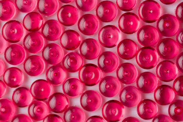 istock Red acrylic beads on a white background 1034783820