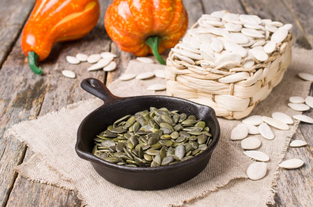 istock Pumpkin seeds in a pan 1034786670