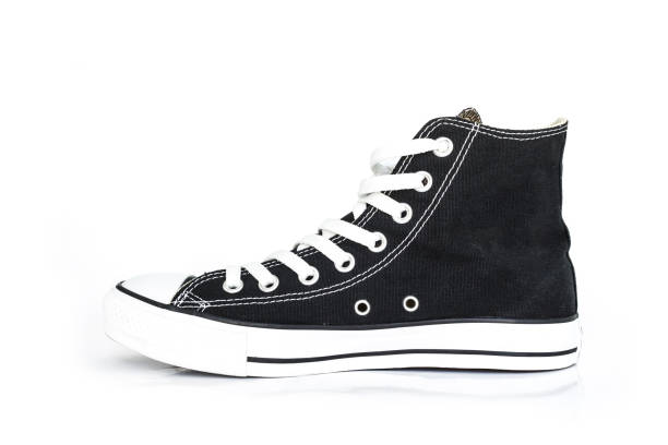 istock black sneakers classic vintage shoe on white background 1034807754