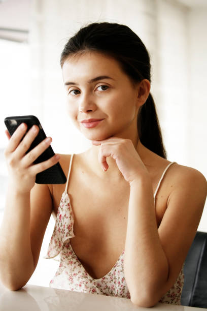 istock A young woman using her phone 1034812802