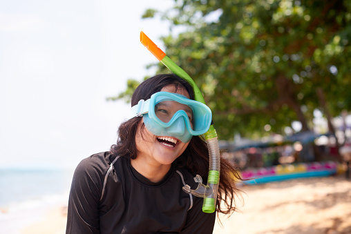 Cropped shot of an attractive young woman wearing her snorkelling gear at the beach