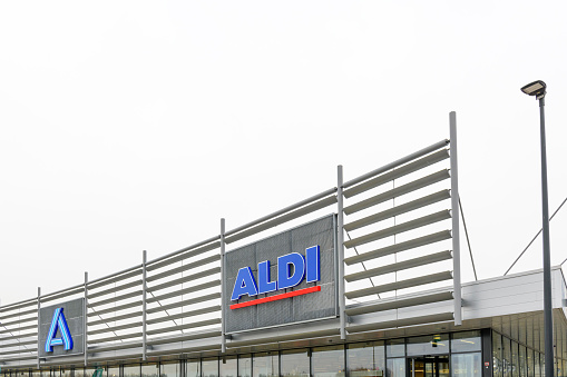 Aldi sign above an Aldi supermarket supermarket. Aldi is a leading German discount supermarket chain with over 10 000 stores in 18 countries