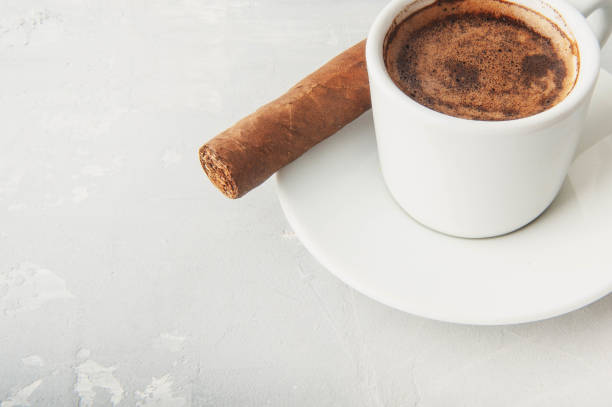 istock Cup and Turk coffee, cigar and guillotine isolated on white background. 1034829754
