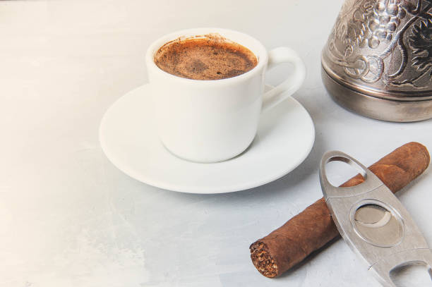 istock Cup and Turk coffee, cigar and guillotine isolated on white background. 1034829848