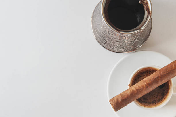 istock Cup and Turk coffee, cigar and guillotine isolated on white background. 1034830060