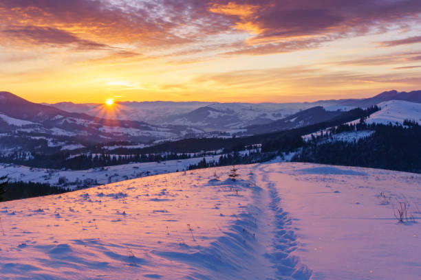 istock Winter sunrise in the hills mountains. 1034836122