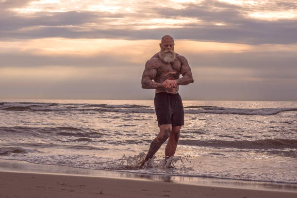 istock Tattooed Senior Man During Workout 1034839758