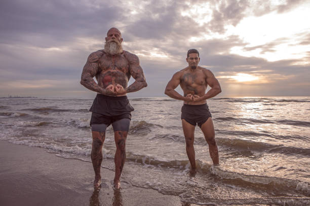 istock Tattooed Senior Man coaching young man During Workout 1034842560