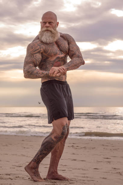 istock Tattooed Senior Man During Workout 1034842588
