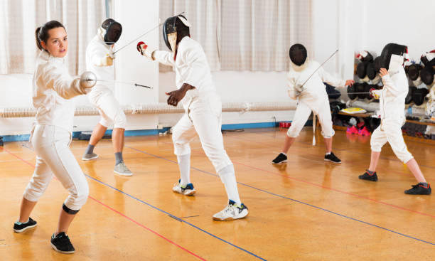 istock Woman training fencing movements 1034845344