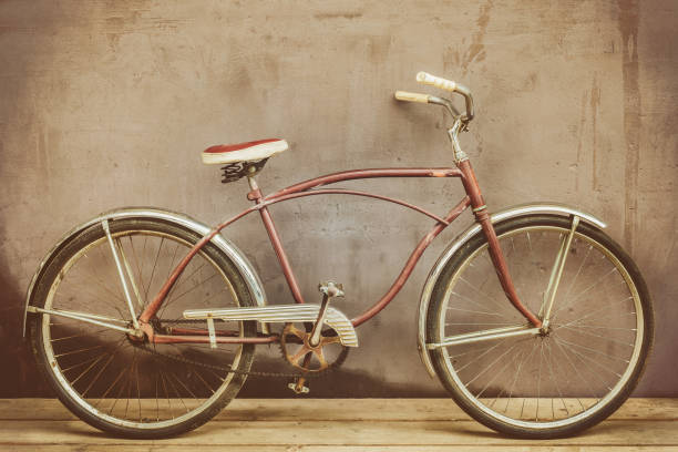 istock Vintage rusted cruiser bicycle on a wooden floor 1034845538