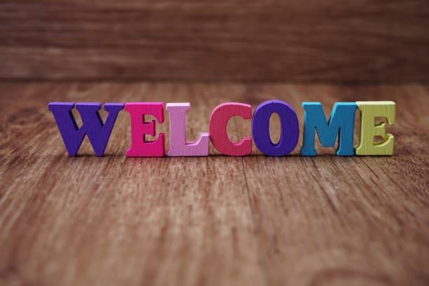 istock colorful text welcome letters alphabet on wooden background 1034848024