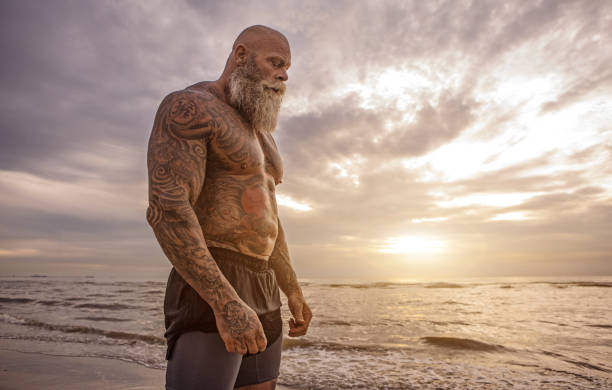 istock Tattooed Senior Man During Workout 1034848882