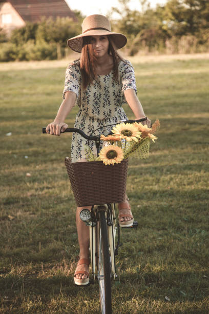 istock Woman riding a bicycle in nature 1034850318