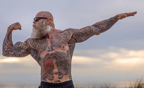 istock Tattooed Senior Man During Workout 1034850560