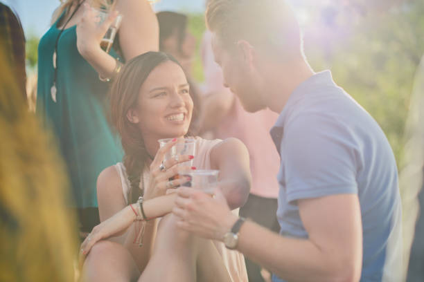 istock Couple sitting outdoor party 1034855166