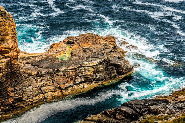 istock water splashing on rocks in the sea 1034855364