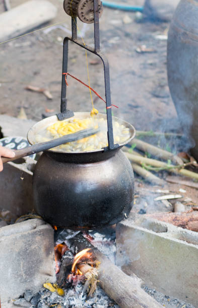 istock Boiling Yellow silkworm cocoons in the pot to make Silk Thread 1034862250
