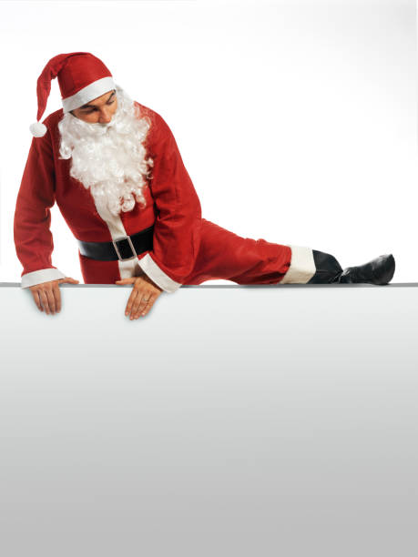 istock santa claus climbing over a small wall 1034869998