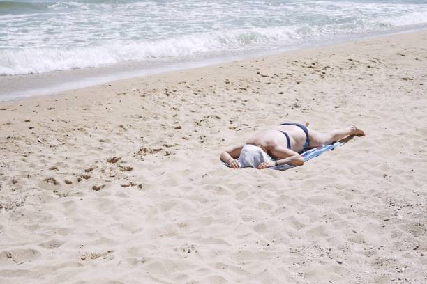 istock Woman Relaxing At Beach On Sunny Day 1034873384