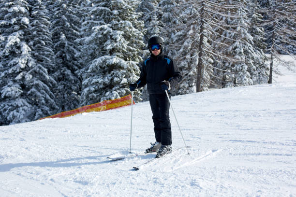 istock Young man, skiing in Austrian Alps 1034873630