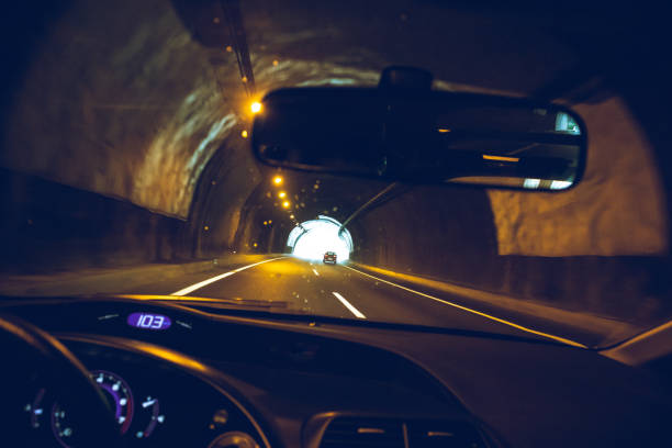 istock Driving a car inside a dark tunnel 1034873896