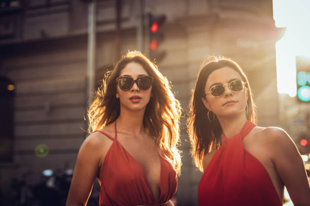 istock Two women on city street having fun 1034881682