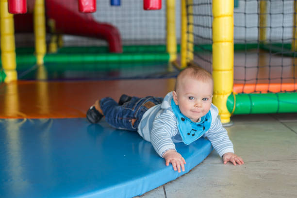 istock Little baby boy, playing in indoor playground 1034883118
