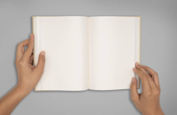 Top View Two Hands Hold A Empty Book Spread Stock Photo - Download