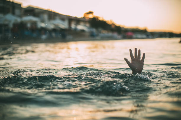 istock Man drowning in the water 1034893312