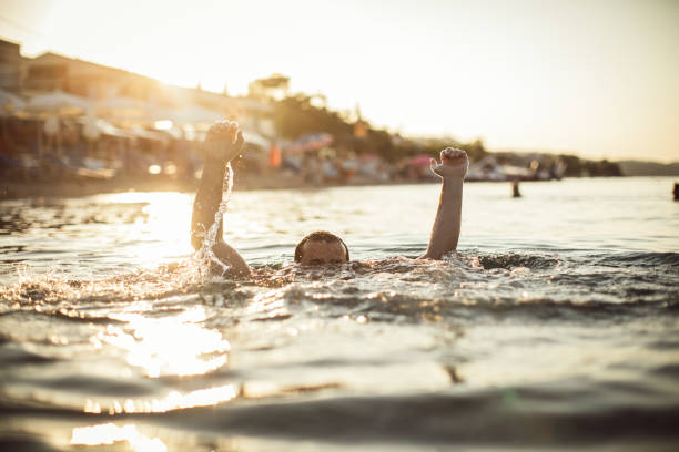 istock Man drowning in the water 1034895020