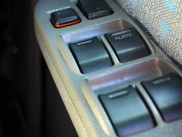 istock buttons controlling the windows in a car 1034918786