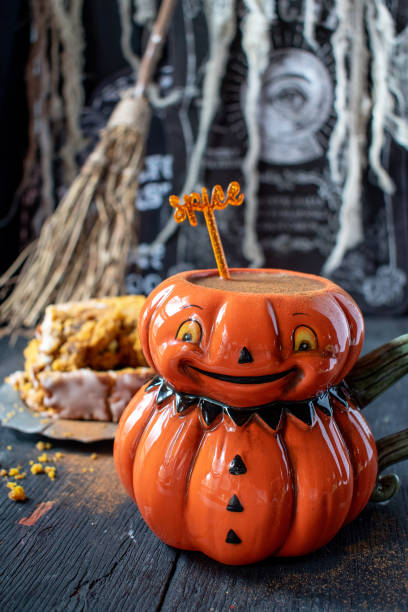 istock Fun colorful pumpkin mug filled with pumpkin spice drink 1034918868