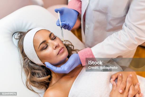 Getting Some Help With Those Wrinkles Stock Photo - Download Image Now - Botulinum Toxin Injection, Injecting, Syringe