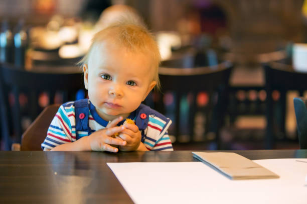 istock Little boy, child, enjoying breakfast in hotel restaurant 1034925730