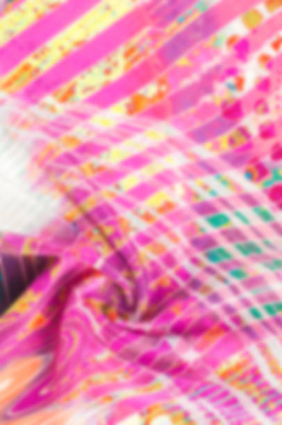 istock Blur the silky background. Texture background image, Silk fabric with abstract pattern. Colorful silk fabric close-up. Photo of silk fabric. Textile design. Painting fabrics, silk painting in batik 1034928800