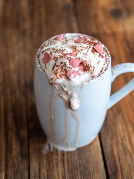 istock Hot chocolate with cream and pink hearts 1034931144