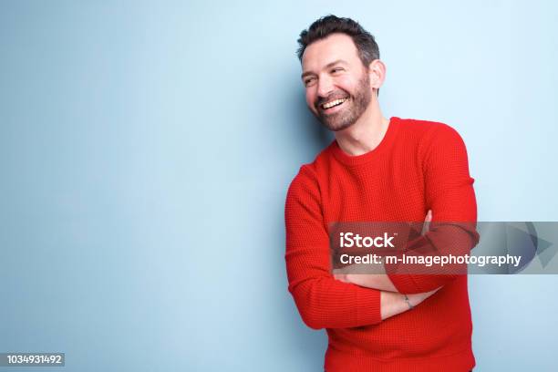 Cheerful Man With Beard Laughing Against Blue Background Stock Photo - Download Image Now